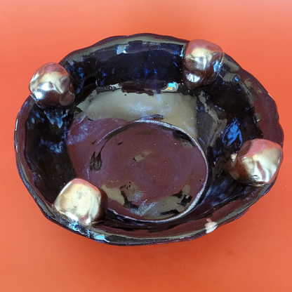 bowl with clay heads