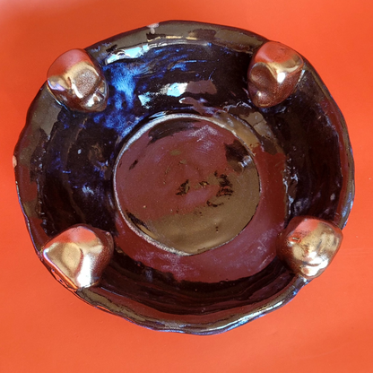 bowl with clay heads