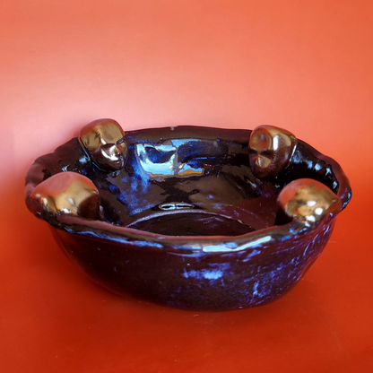 bowl with clay heads