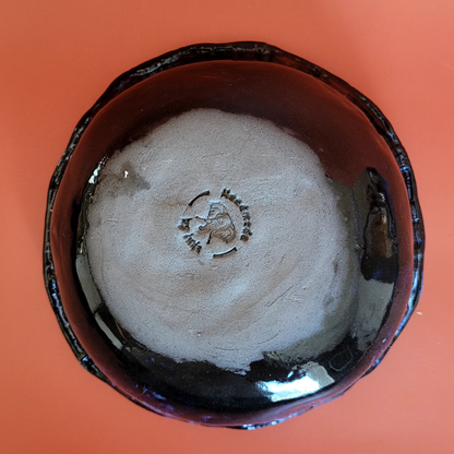 bowl with clay heads