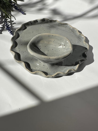 Egg cup in wavy plate shape